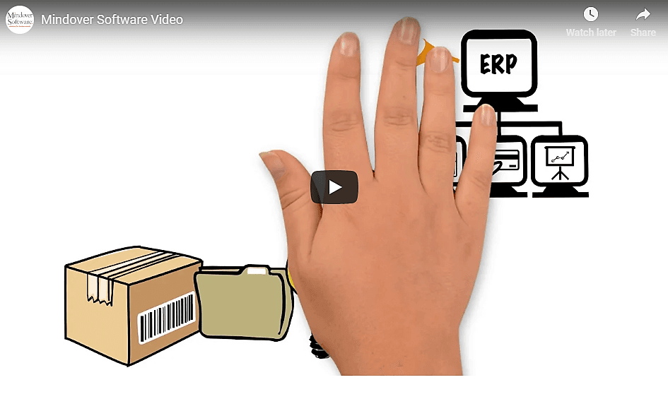 A screenshot from a video with a hand covering illustrations of computers