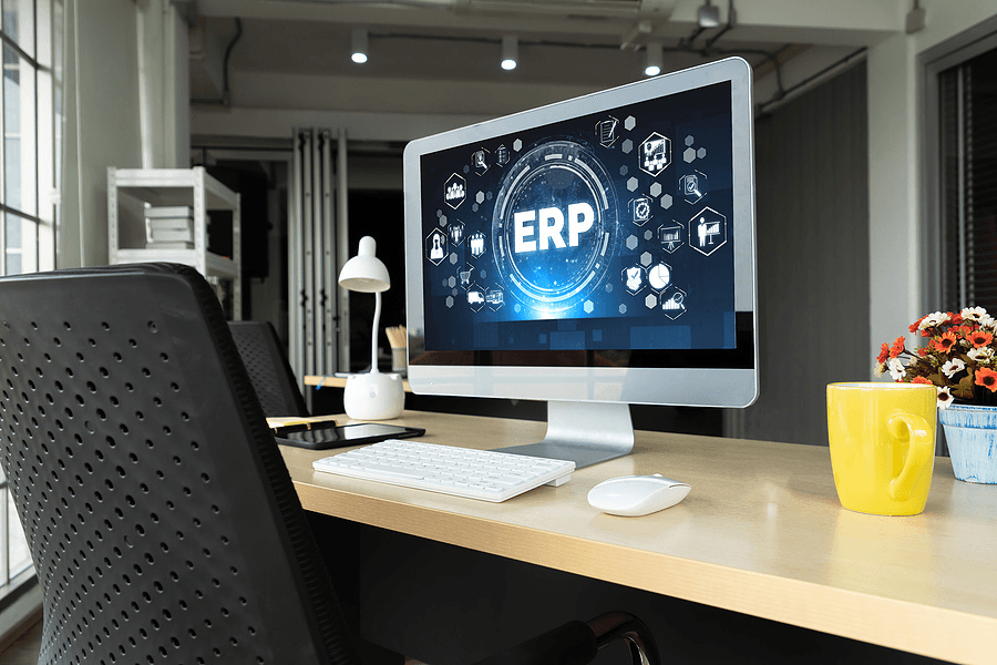 computer monitor on desk with ERP on screen