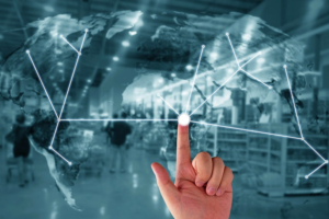 warehouse background with global overlay showing routes between points to represent supply chain routes