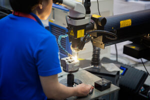 Technical Specialties and job shop conceptual with welder working on parts.